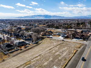 Birds eye view of property with a residential view and a mountain view