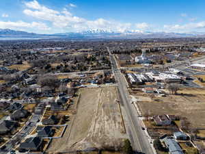 Drone / aerial view with a residential view and a mountain view