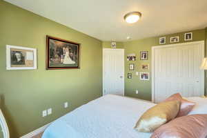 Bedroom featuring a closet and carpet flooring