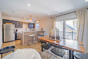 Dining Area with Sliding Glass Doors to Private Deck.