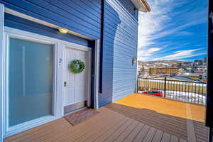 Deck featuring covered porch to Front Door with Mountain View