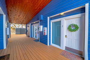 Deck featuring covered porch to Front Door