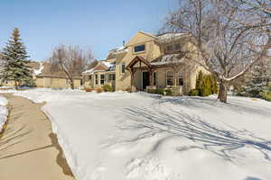 Traditional-style home featuring stucco siding