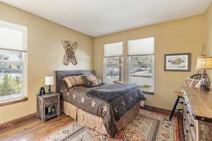 Bedroom featuring light wood-style flooring and baseboards