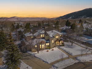 Aerial view at dusk with a residential view and a mountain view