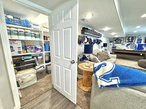 storage under the stairs in kitchenette.