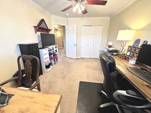 Bedroom 2 featuring ceiling fan, ornamental molding, baseboards, and light colored carpet