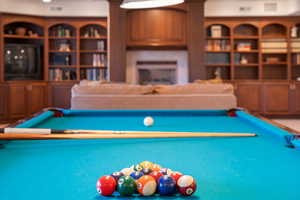 Rec room featuring a fireplace and billiards