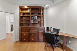 Office featuring light wood-type flooring and baseboards