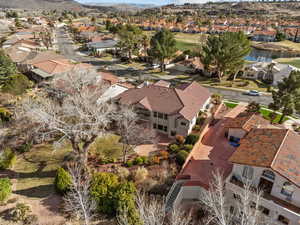 Birds eye view of property featuring a water view and a residential view