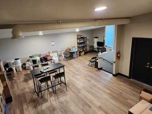 Dining area featuring light wood-style flooring and baseboards