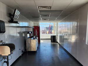 Interior space with a drop ceiling and visible vents
