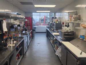 Kitchen with a drop ceiling and visible vents