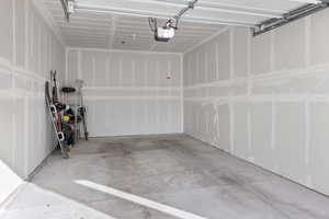 Garage featuring a garage door opener