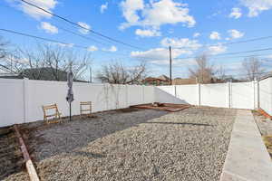 View of yard featuring a patio and a fenced backyard