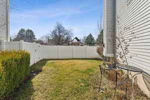 View of yard with a fenced backyard