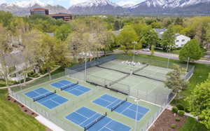 View of tennis court with a mountain view