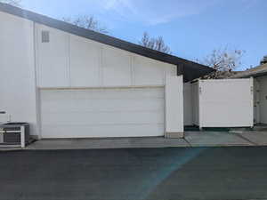 Garage featuring central air condition unit