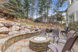 View of patio / terrace featuring an outdoor fire pit