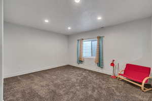 Unfurnished room with carpet, visible vents, baseboards, and recessed lighting