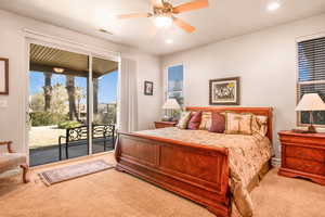 Carpeted bedroom with a ceiling fan, access to outside, visible vents, and recessed lighting