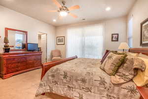 Bedroom featuring recessed lighting, visible vents, ceiling fan, and carpet flooring