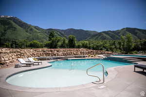 Community pool featuring a mountain view