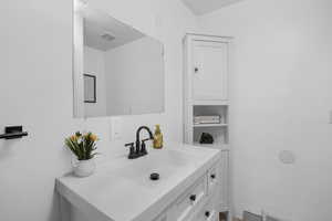 Bathroom featuring vanity and visible vents