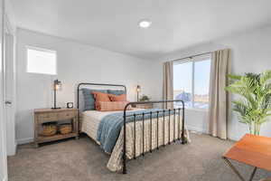 Carpeted bedroom featuring baseboards