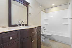 Full bath with visible vents, toilet, vanity, tile patterned flooring, and shower / bathtub combination