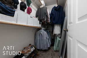 Spacious closet featuring carpet floors