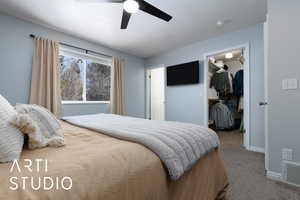 Bedroom with carpet floors, visible vents, baseboards, a spacious closet, and a closet