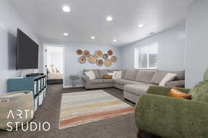 Living area featuring baseboards, dark colored carpet, visible vents, and recessed lighting