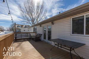 Wooden deck featuring french doors