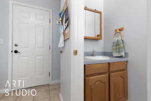 Bathroom with vanity and tile patterned floors