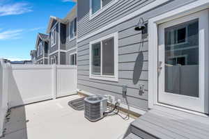 View of patio / terrace with central air condition unit and fence