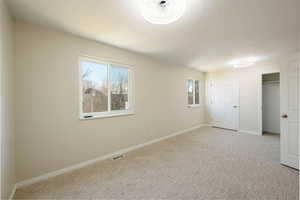 Another view of the large second bedroom on the upper level. All new windows, carpet & paint.