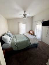 Carpeted bedroom featuring a ceiling fan