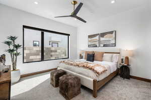 Bedroom featuring a ceiling fan, recessed lighting, light colored carpet, and baseboards