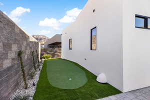 View of yard featuring a fenced backyard and a mountain view