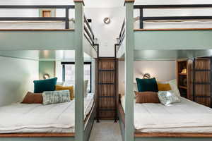 Bedroom featuring carpet floors and a high ceiling