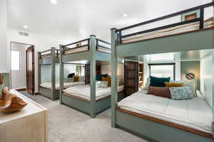 Bedroom featuring light carpet, recessed lighting, visible vents, and baseboards