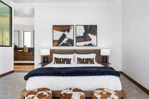 Bedroom featuring baseboards and carpet flooring