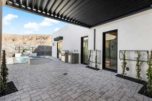 View of patio / terrace featuring grilling area, area for grilling, an outdoor fire pit, a mountain view, and fence