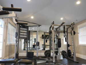 Gym with baseboards and recessed lighting