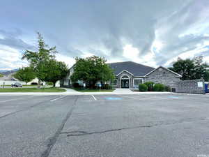 View of front of house featuring uncovered parking