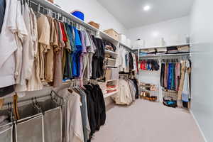 Spacious closet featuring carpet floors