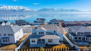 Birds eye view of property featuring a residential view and a water and mountain view