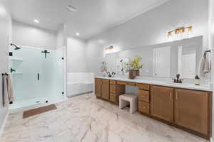 Full bathroom with a sink, visible vents, marble finish floor, a bath, and a stall shower