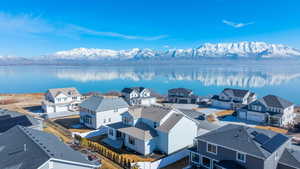 Aerial view featuring a residential view and a water and mountain view